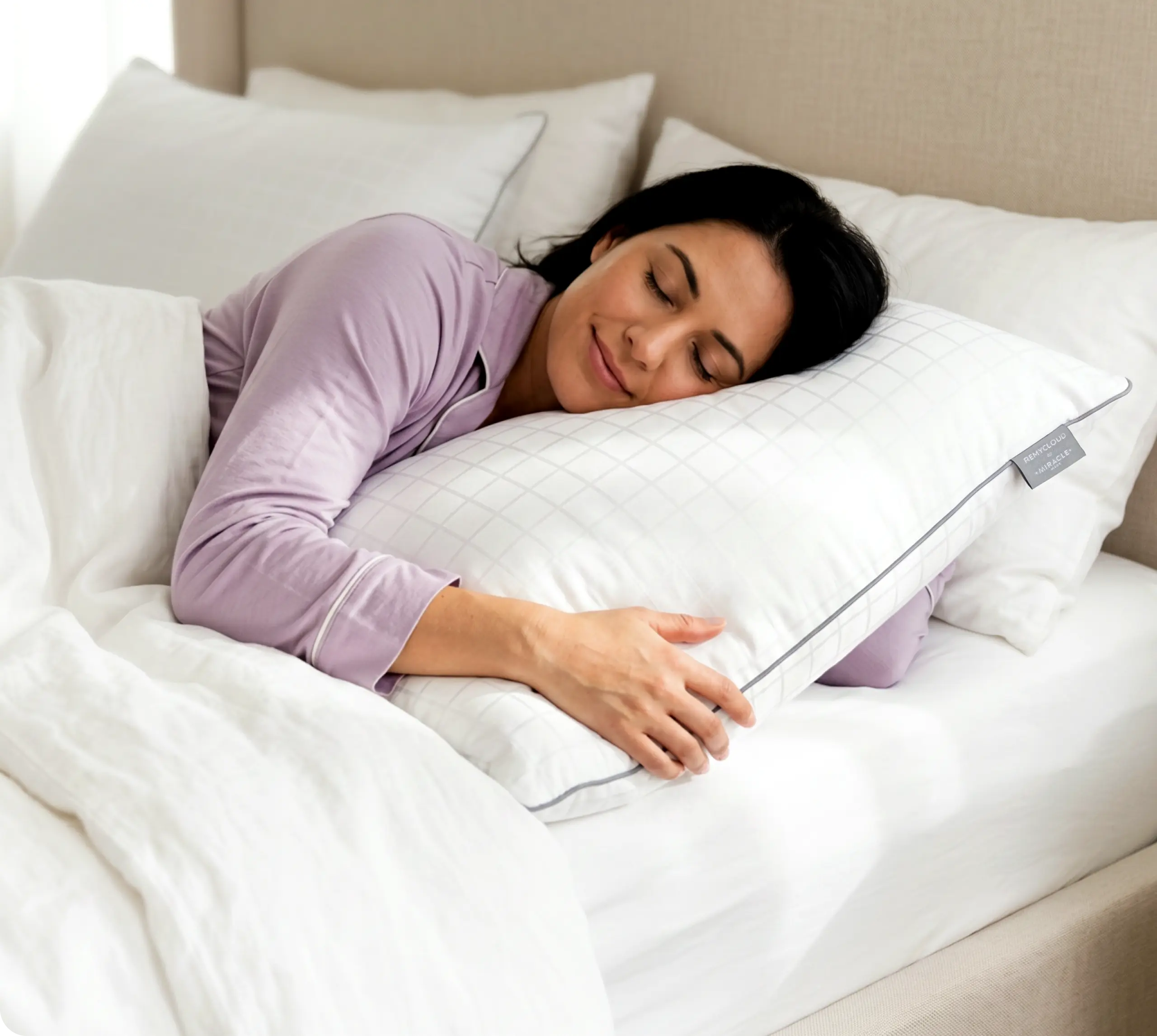 Woman sleeping comfortably on a RemyCloud pillow