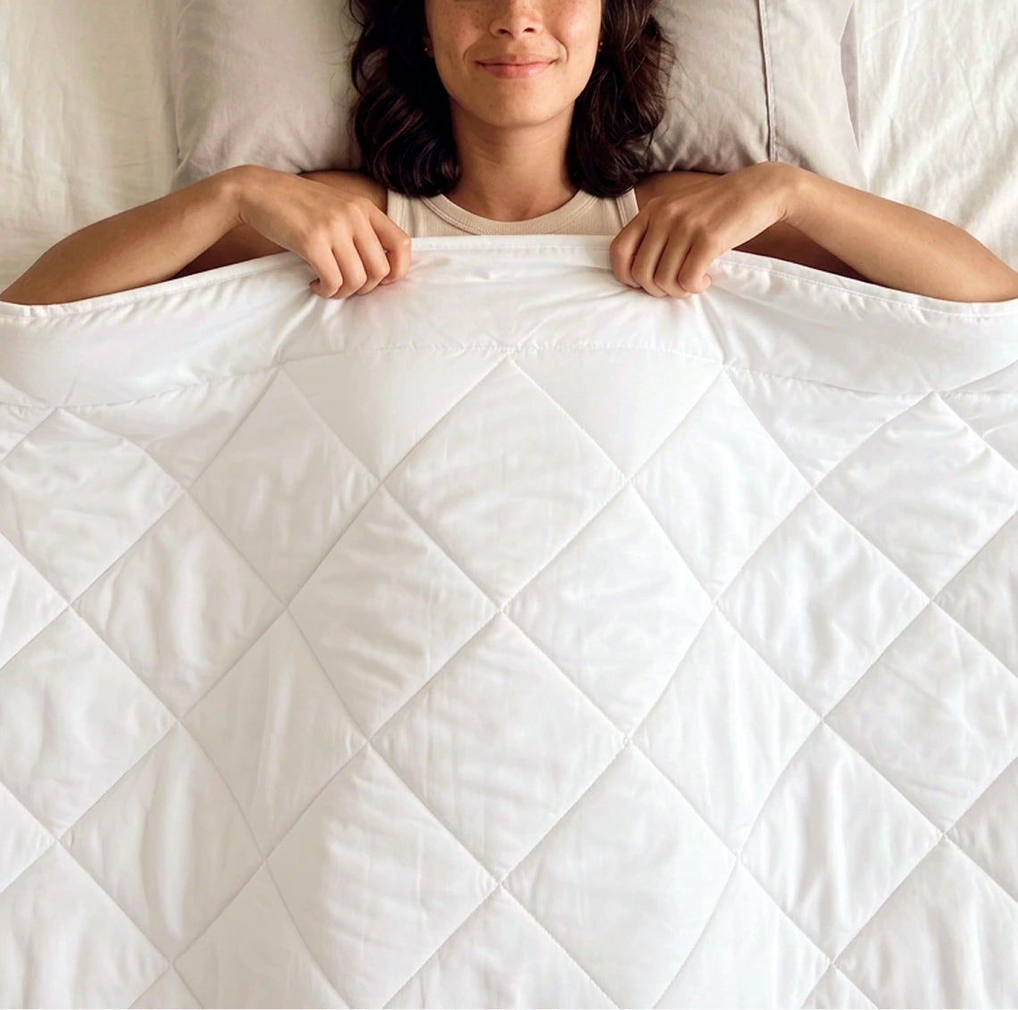 Sleeper comfortably holding the Miracle Made Cooling Comforter